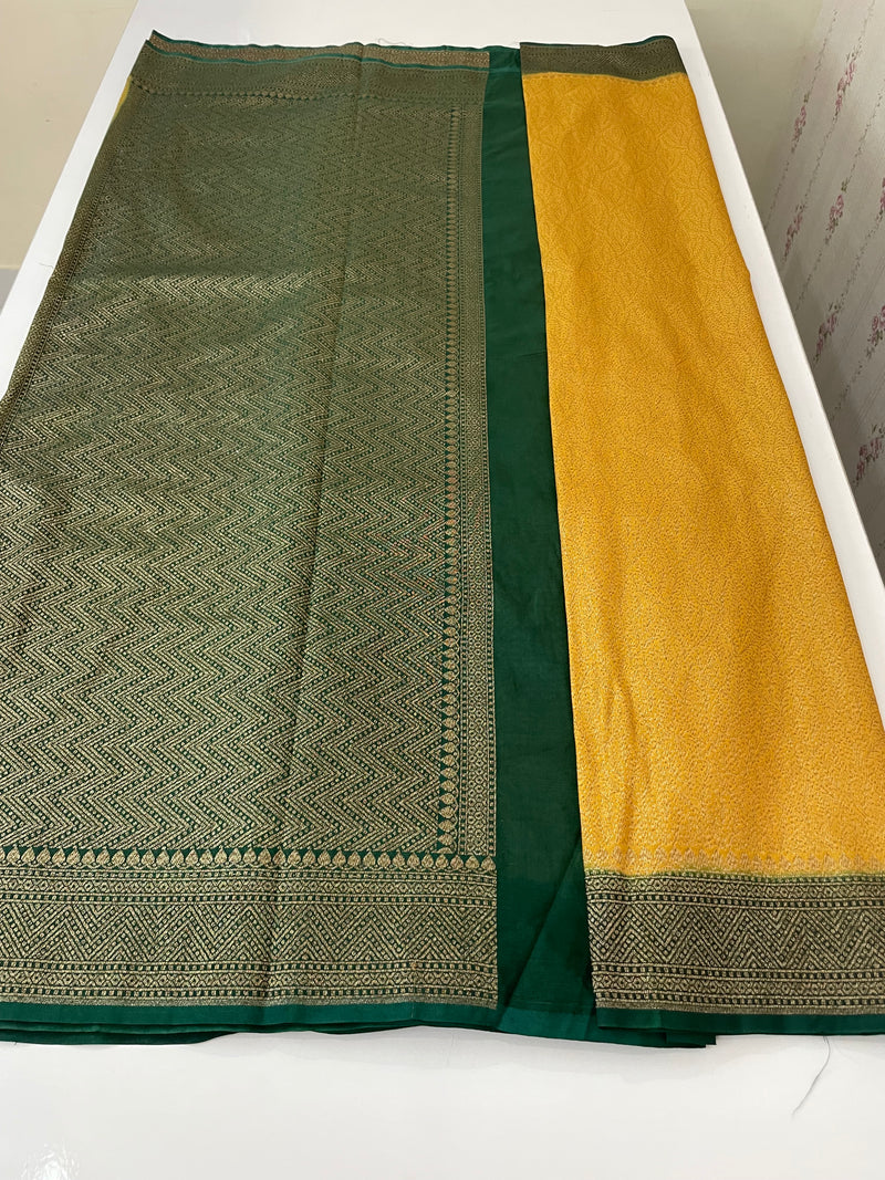 Banarasi semi katan saree with contrast border SHKNTNM- Creamy Yellow to BottleGreen
